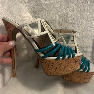 Lightly wore once. Sexy stiletto White and Teal and sliver Platform heels